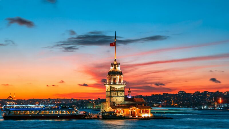 Maiden's Tower at sunset in Istanbul, Turkey, with Bosphorus Strait and city skyline